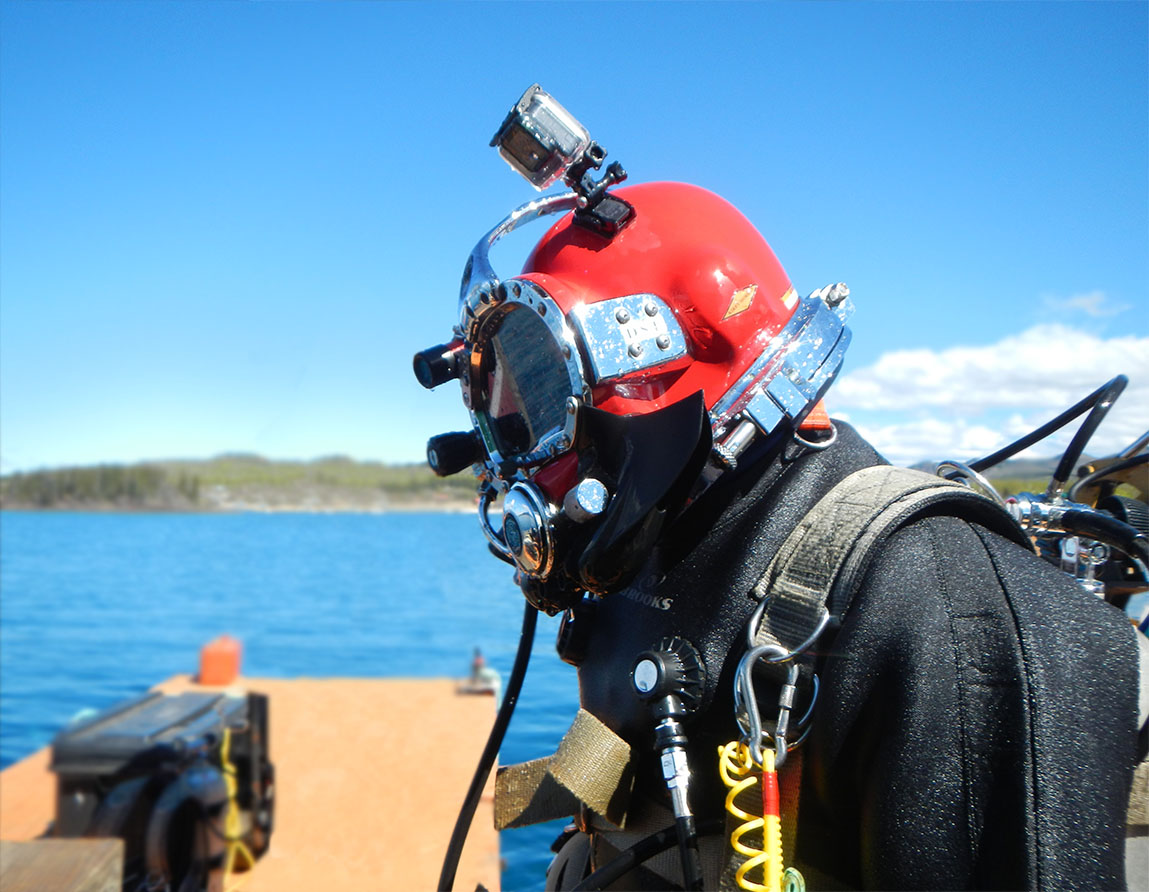 A diver preparing to install the geothermal exchange unit