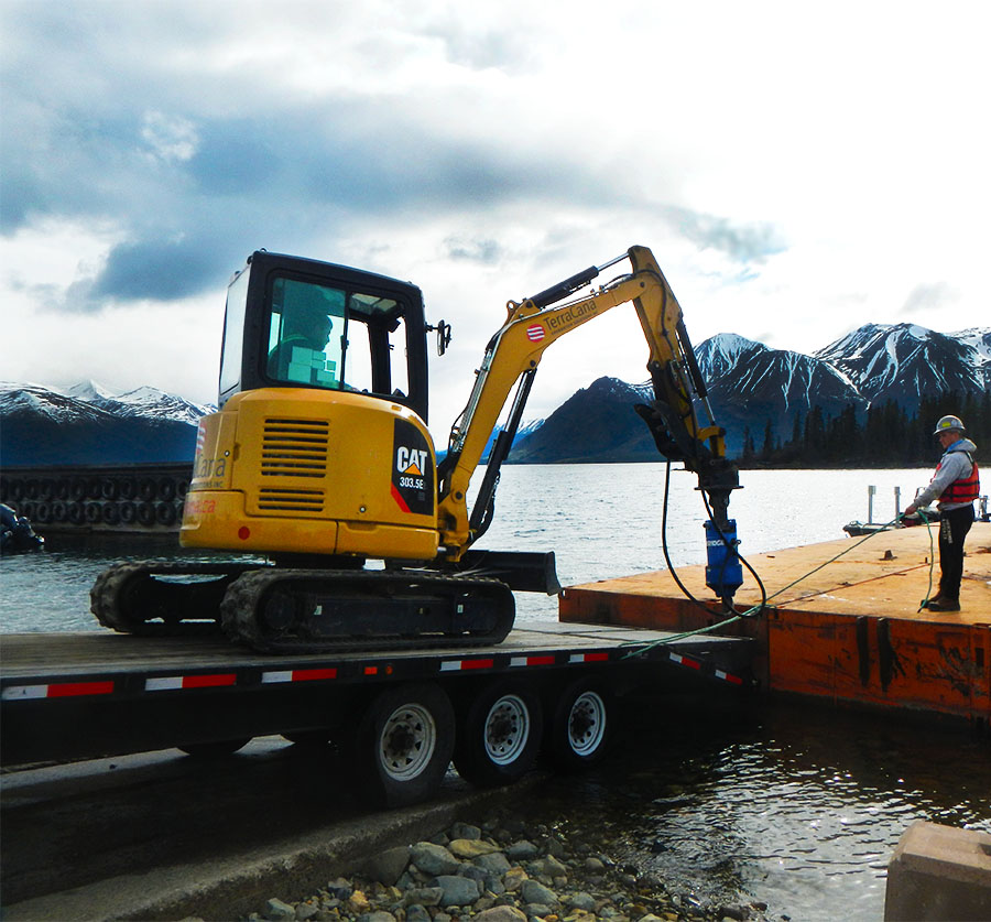 TerraCana CAT being loaded onto the floating barge