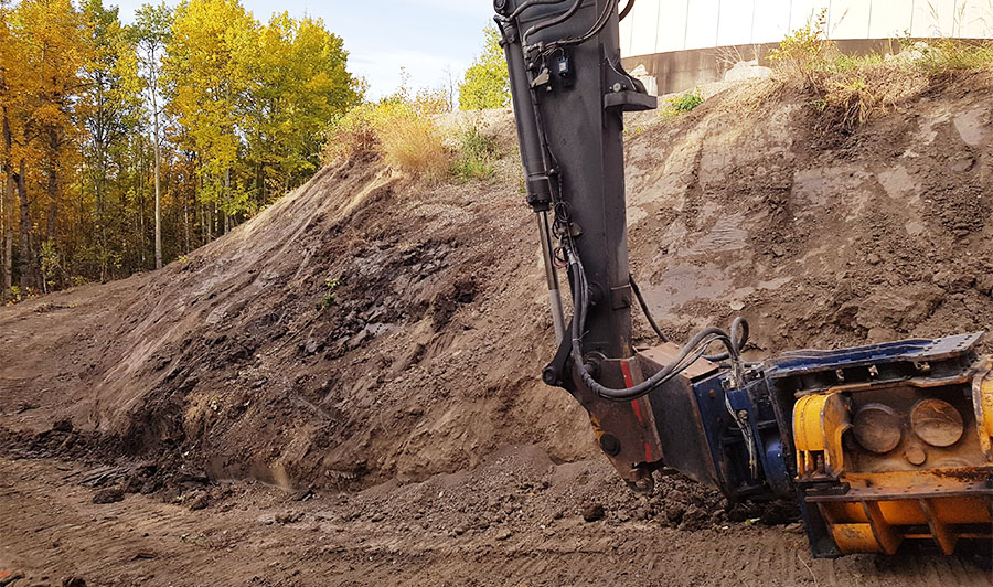 Our sheet-pile driver rests on the site