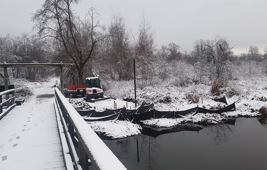 Winter bridge installation with helical piles